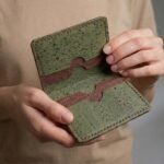 green and brown cork cardholder with model